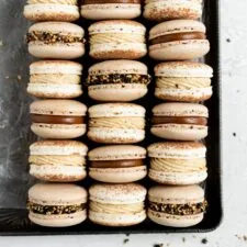 CHOCOLATE MACARONS WITH SALTED CARAMEL TAHINI MILK CHOCOLATE GANACHE AND SESAME BRITTLE