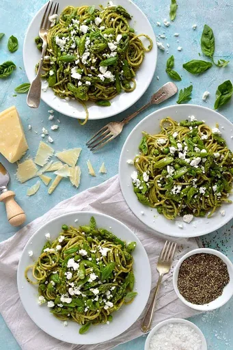 Spaghetti With Lemony Rocket & Walnut Pesto, Asparagus, Peas & Goat's Cheese