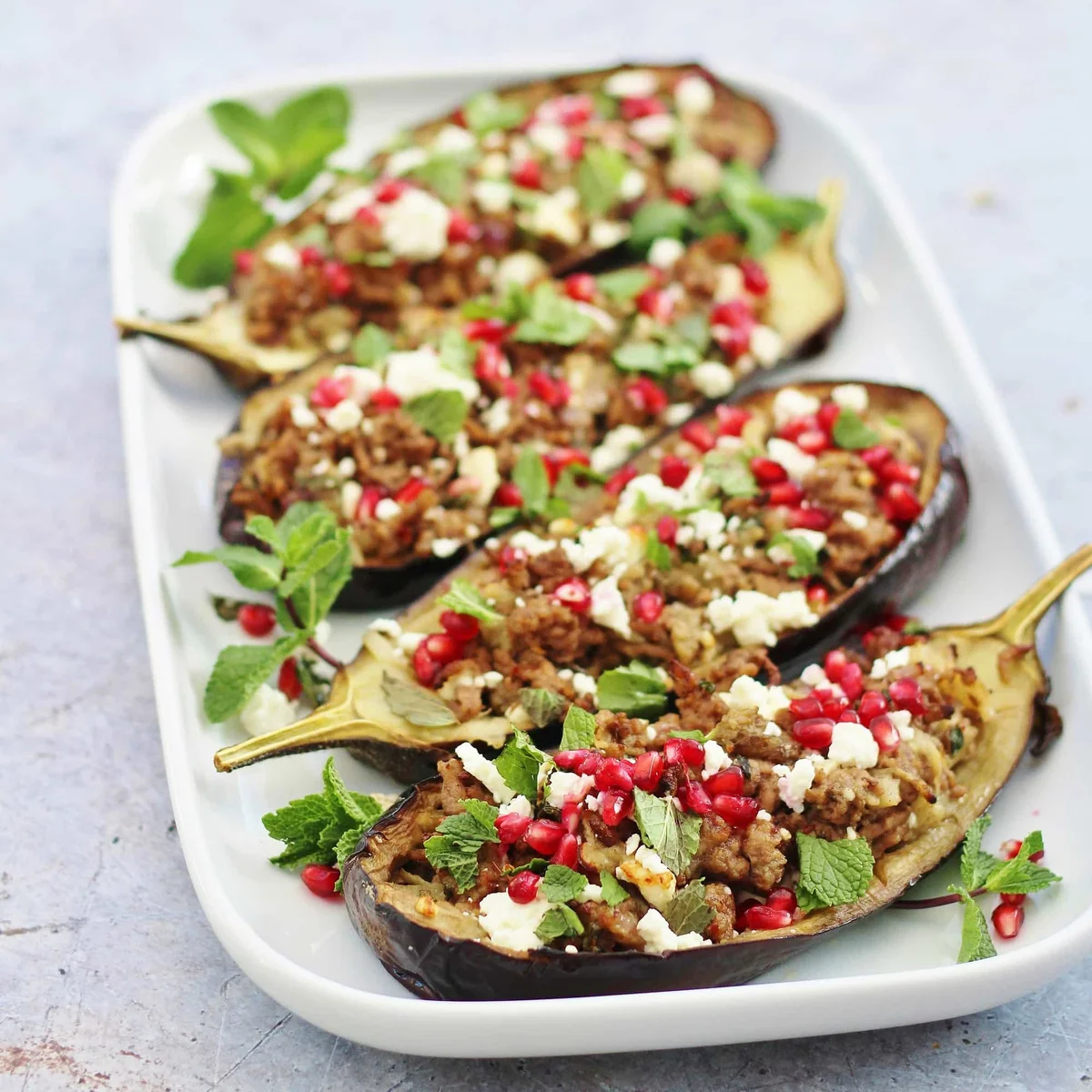 Lamb Stuffed Aubergines with Mint, Feta and Pomegranate Seeds