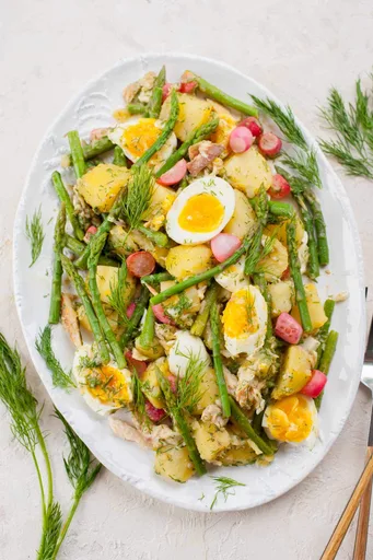Potato and asparagus salad with eggs and smoked trout