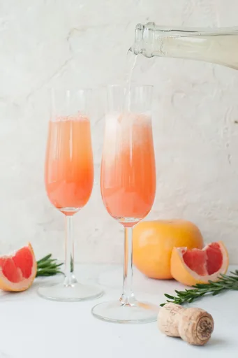 Grapefruit mimosa with rosemary