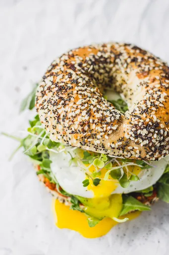 Vegetarian Breakfast Bagel Sandwich with Romesco