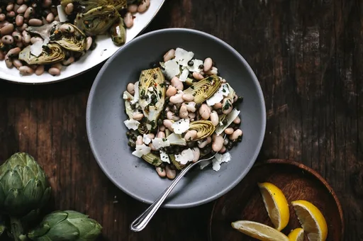 Warm Braised Baby Artichoke Salad with White Beans and Manchego