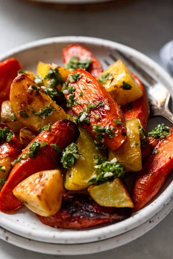 Oven Roasted Yukon Gold Potatoes and Carrots with Parsley Sauce