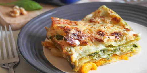 Cheesy roasted squash lasagne with spinach and walnut pesto