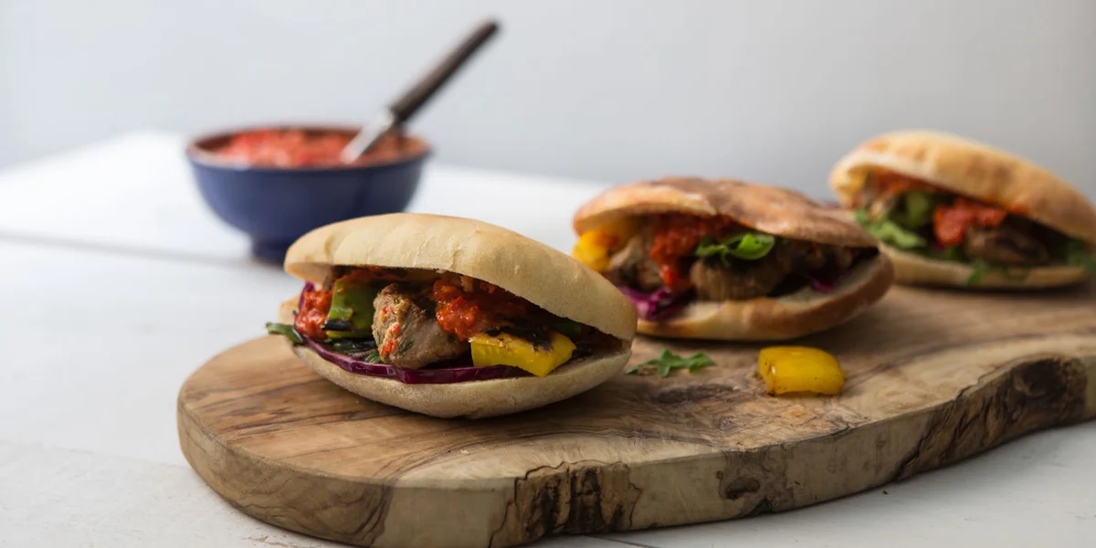 Lamb shish kebabs with harissa and pitta bread