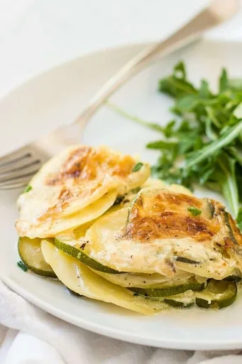 Easy To Prepare Cheesy Potatoes And Zucchini Au Gratin