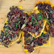 Cashew Polenta with Mushrooms and Tomato Pomegranate Reduction