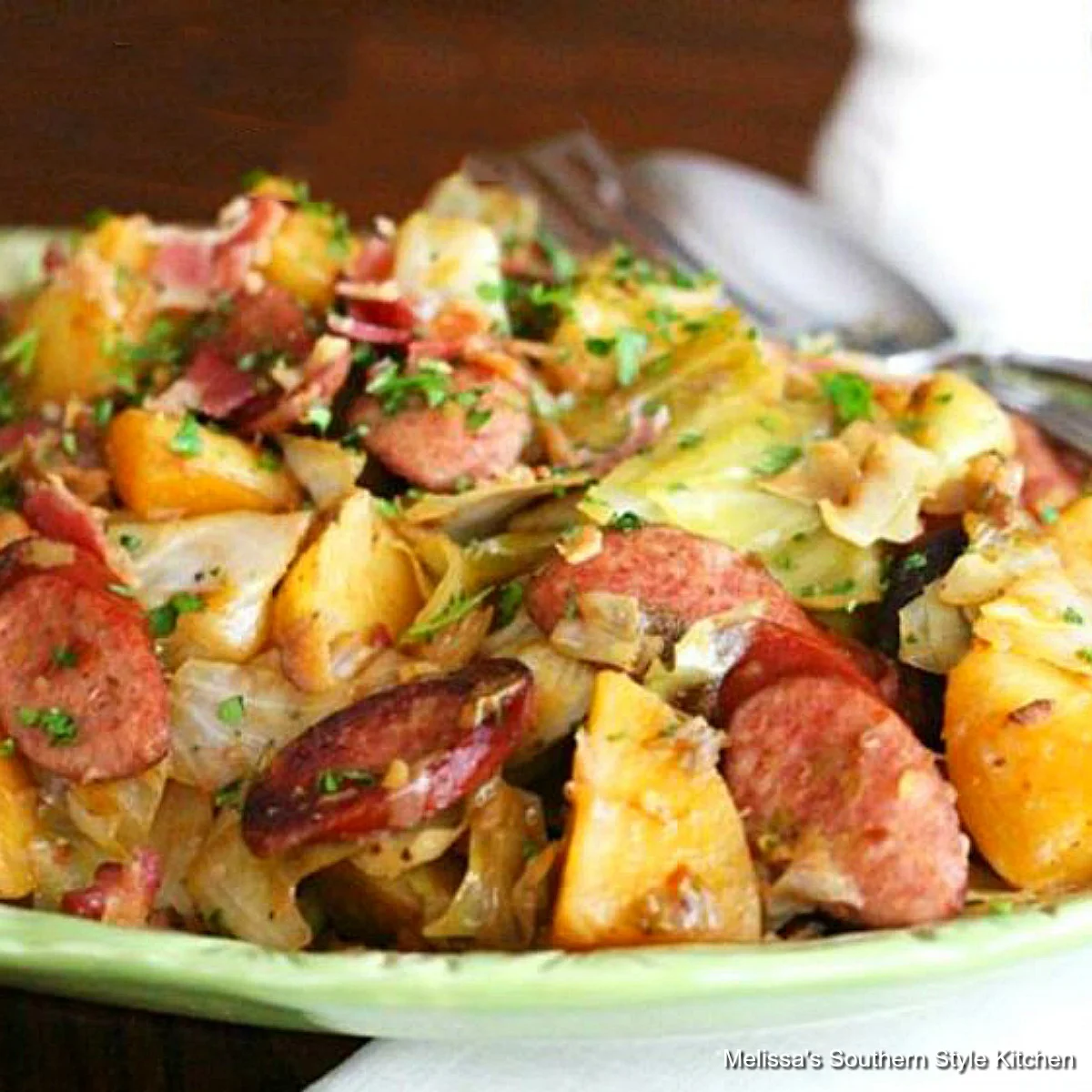Braised Cabbage With Potatoes And Smoked Sausages