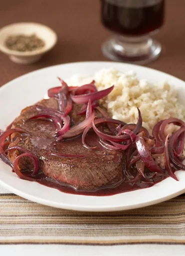 Steak and onions with celeriac mash