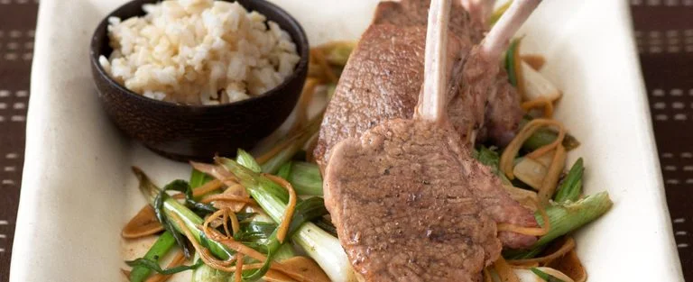 Lamb cutlets with stir-fried spring onions