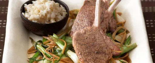 Lamb cutlets with stir-fried spring onions