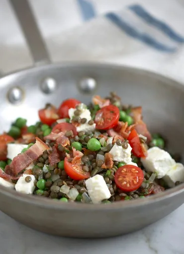 Lentils with peas, feta and bacon