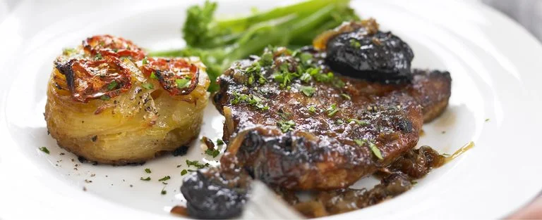 Braised pork chops with cider vinegar and prunes