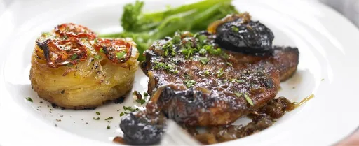 Braised pork chops with cider vinegar and prunes