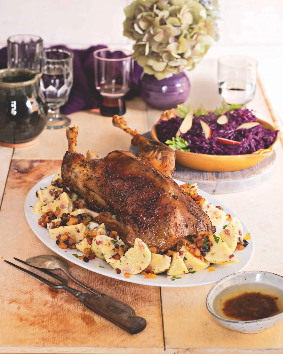Roast goose with cabbage, potato dumplings and apple crackling