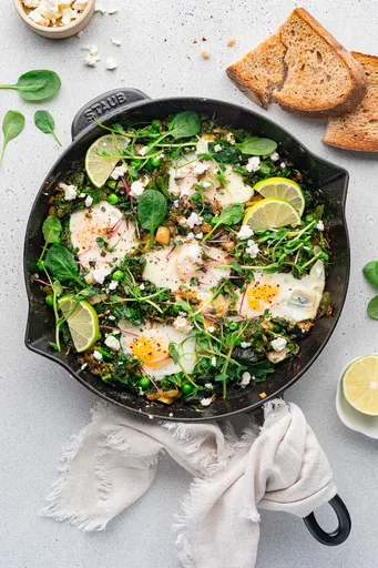 Green Shakshuka with Leek, Zucchini, Kale and Feta