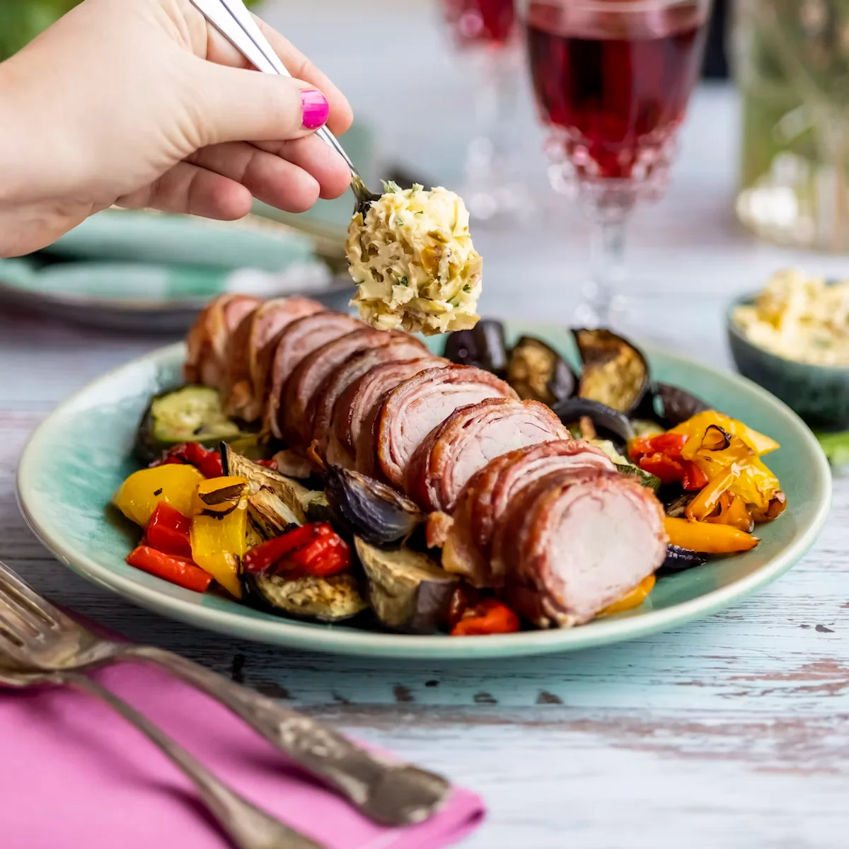 Bacon-wrapped pork tenderloin with garlic butter