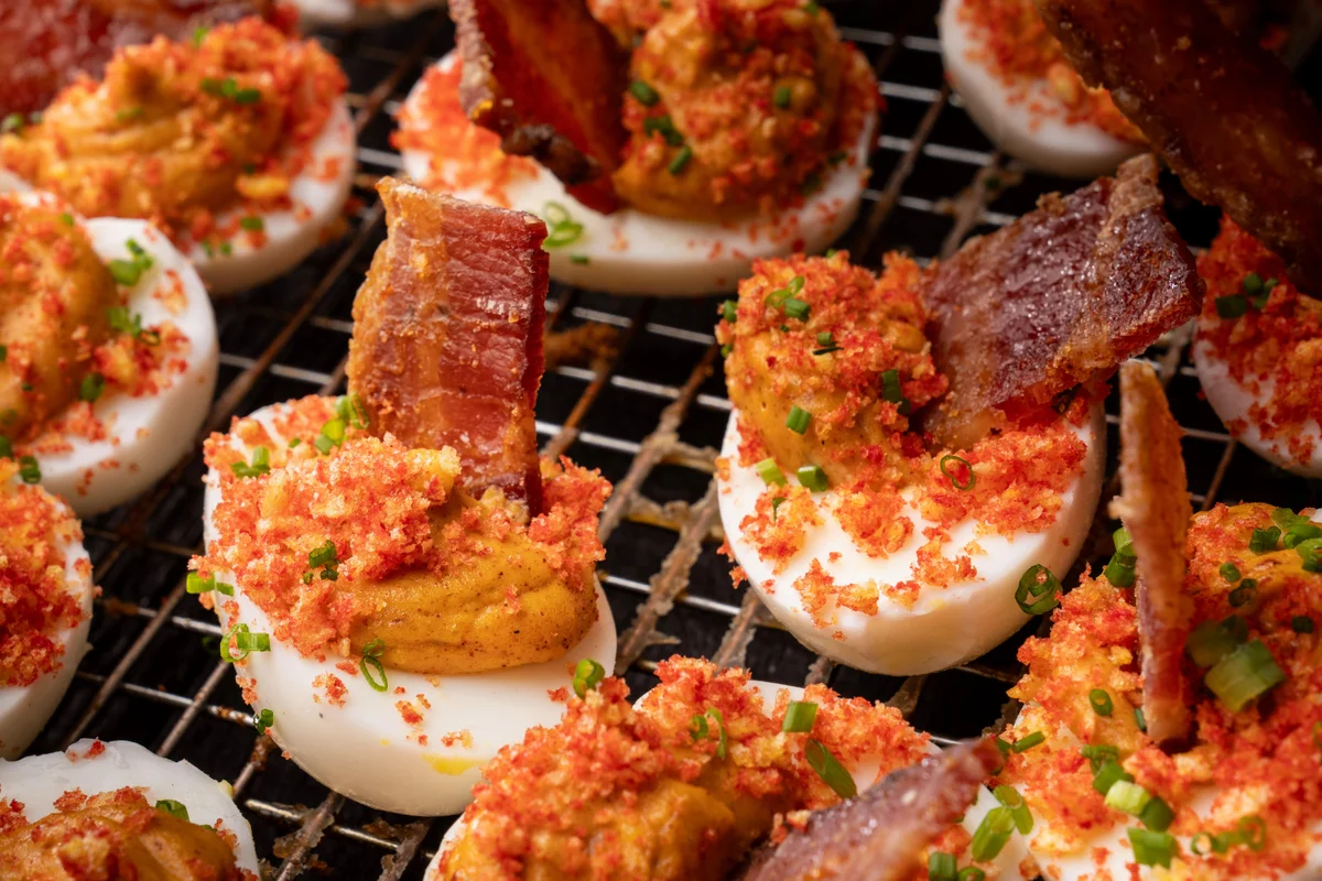 Smoky Garlic Deviled Eggs with Candied Bacon
