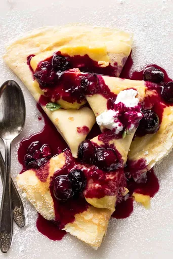 Custard Filled Crepes with Blueberry Sauce