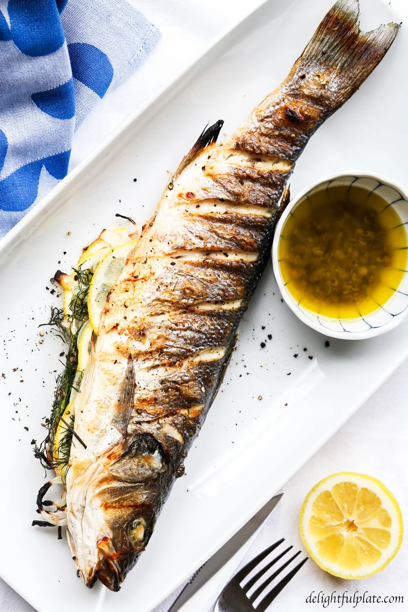 Grilled whole branzino with lemon caper sauce