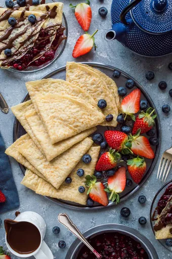 Vegan Crepes With Berry Compote And Chocolate Sauce