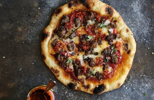 Spicy Sausage Pizza with Calabrian Chilies & Honey