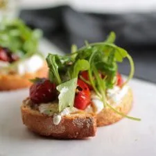Easy Arugula and Blistered Tomato Crostini