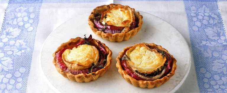 Goat’s cheese and red onion tarts