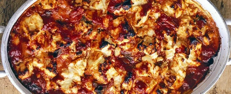 Feta baked with tomato and oregano