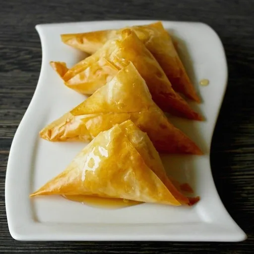 Sweet Cheese Greek Phyllo Triangles Drizzled with Honey