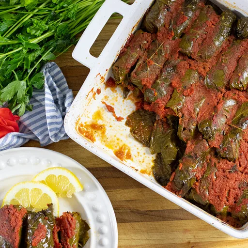 Greek Stuffed Grape leaves in Tomato Sauce: Dolmadakia me Domata