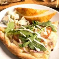 Pear and Gorgonzola Pizza with Arugula and Ranch Dressing