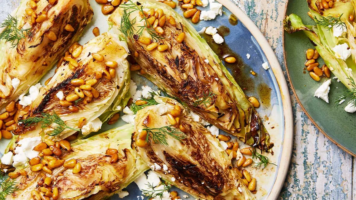 Charred cabbage with spicy brown butter, pine nuts and feta