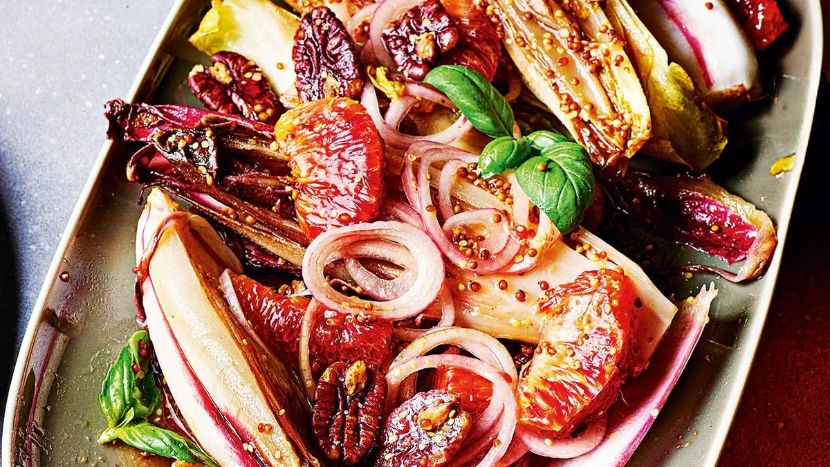 Roasted chicory with blood orange and salted pecans