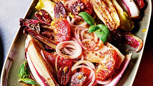 Roasted chicory with blood orange and salted pecans