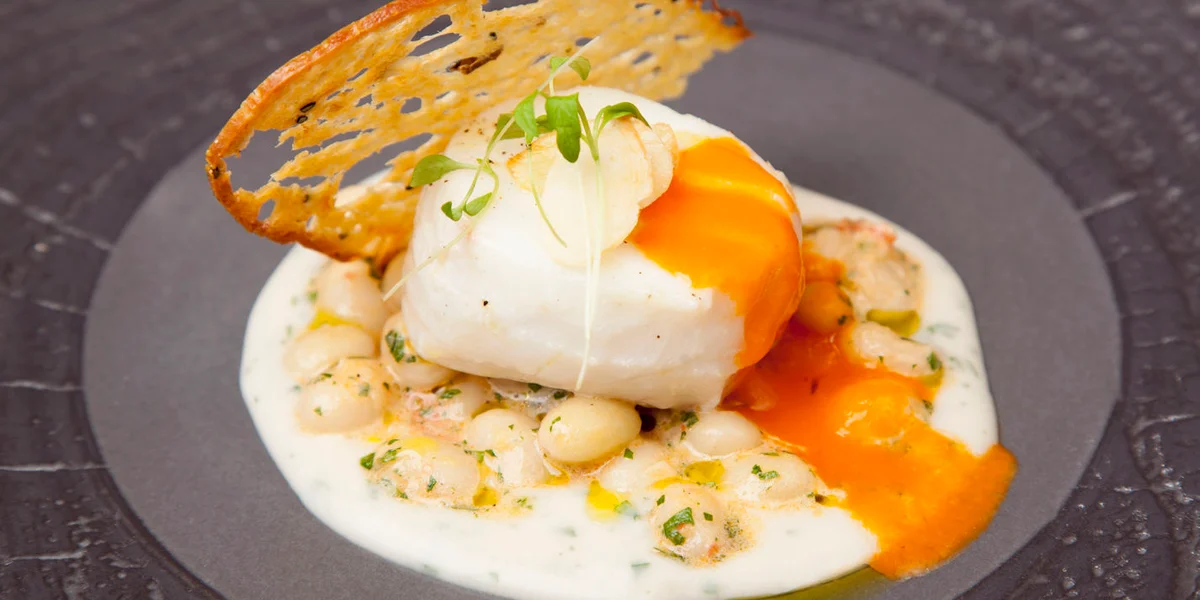 Sous vide cod with coco beans and tomato confit