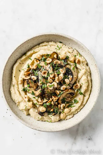 Cauliflower Polenta with Mushrooms and Hazelnuts
