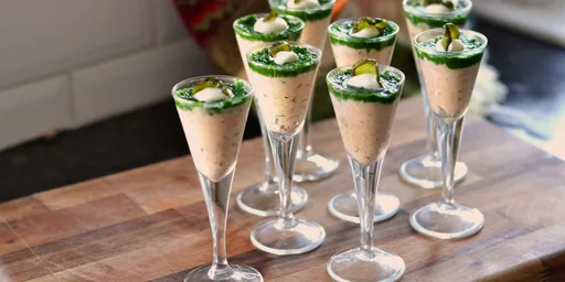 Salmon and crème fraîche shots topped with watercress purée and pickled cucumber