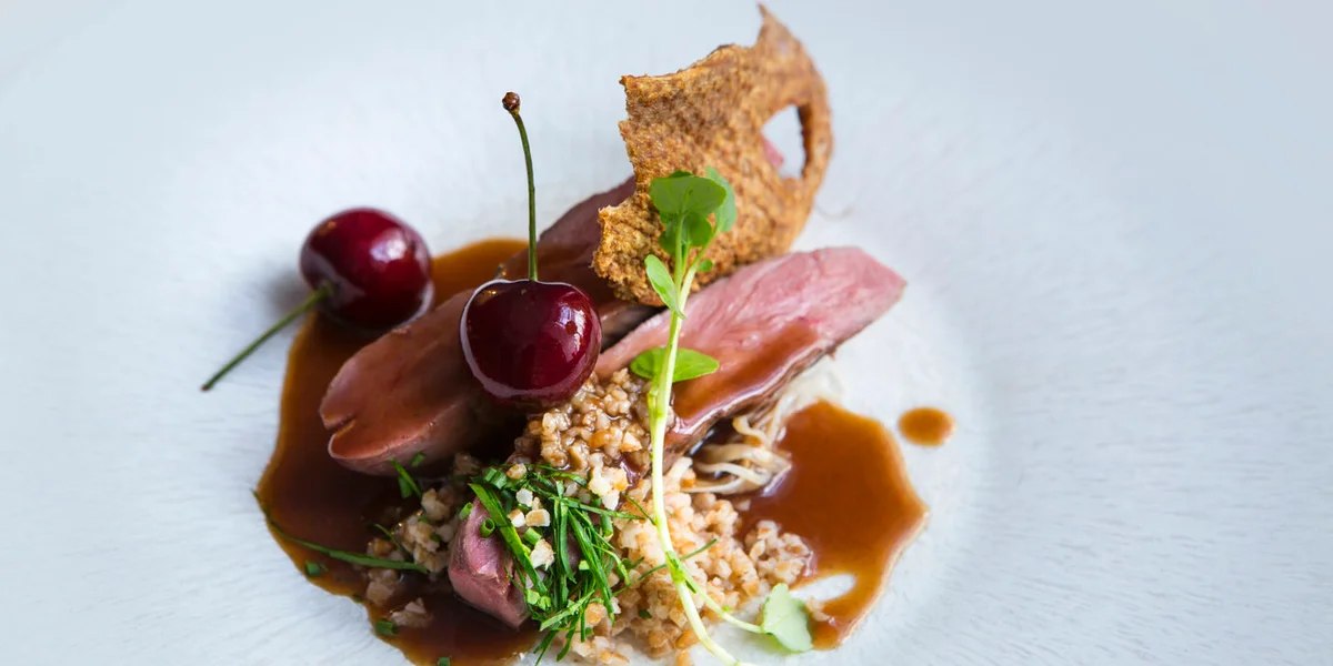 Sous vide duck breast with celeriac choucroute, bulgur wheat and cherries