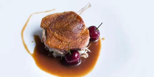 Sous vide duck leg with celeriac choucroute, bulgur wheat and cherries