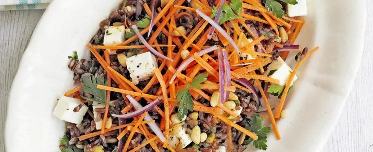 Camargue red rice salad with feta and pine nuts
