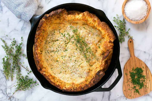 Light, Crisp Herbed Parmesan Dutch Baby