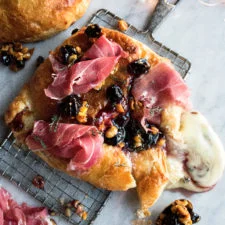 Puff Pastry Wrapped Baked Brie with Prosciutto & Cherry Jam
