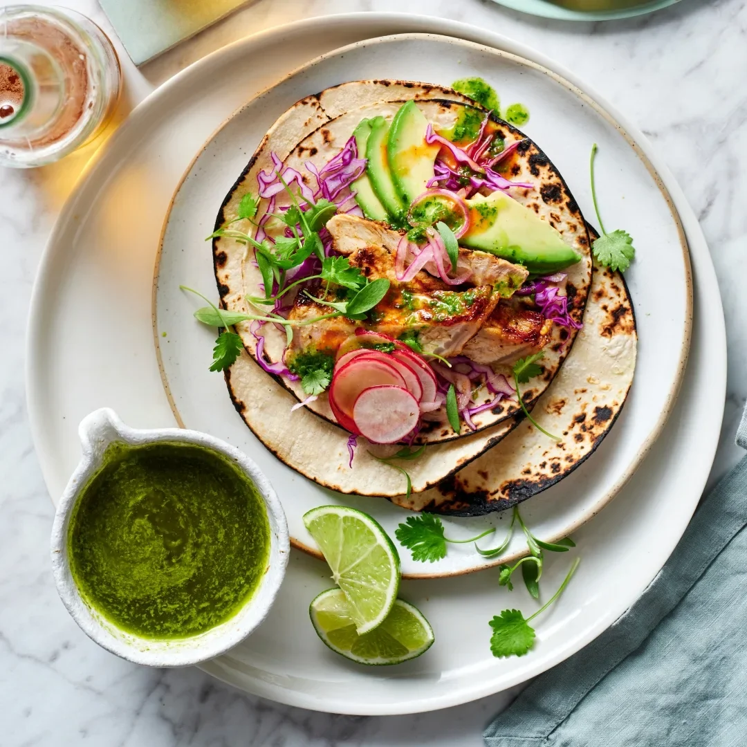 Smoky pork loin tacos with shaved cabbage, pickled onion and salsa verde