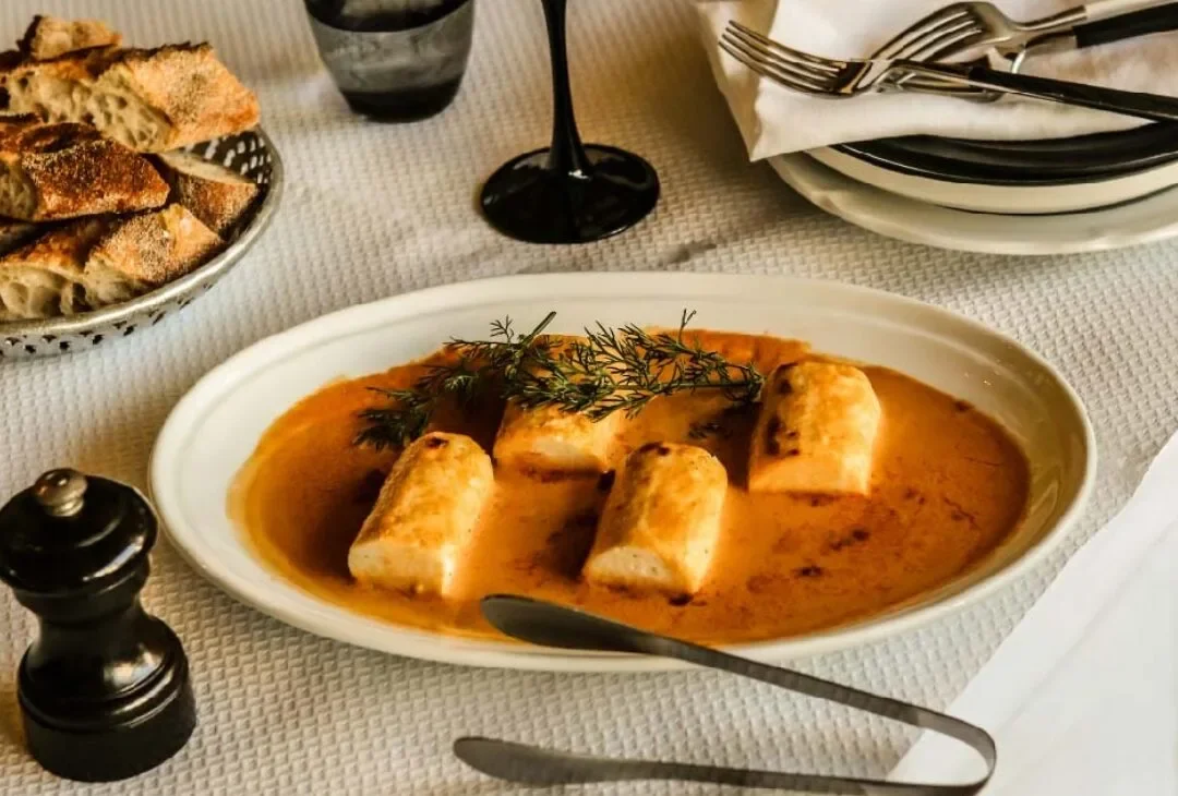 France-Soir’s Quenelles de Perche sauce Crevette: Baked sea perch dumplings in bisque