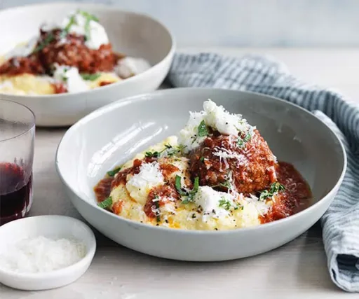 Big pork and prosciutto meatballs with polenta