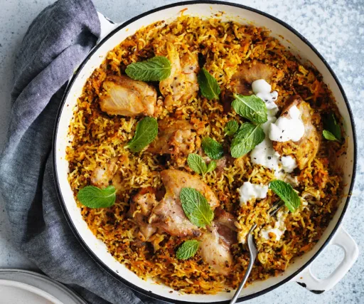 Harissa chicken with carrot, rice and quinoa pilaf