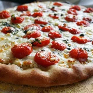 Pizza With Cherry Tomatoes And Goat Cheese