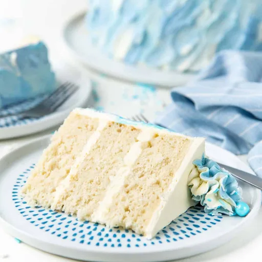 Coconut white cake with lemon Swiss meringue buttercream